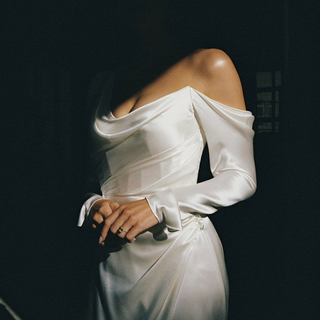 Bride in an off-the-shoulder satin dress