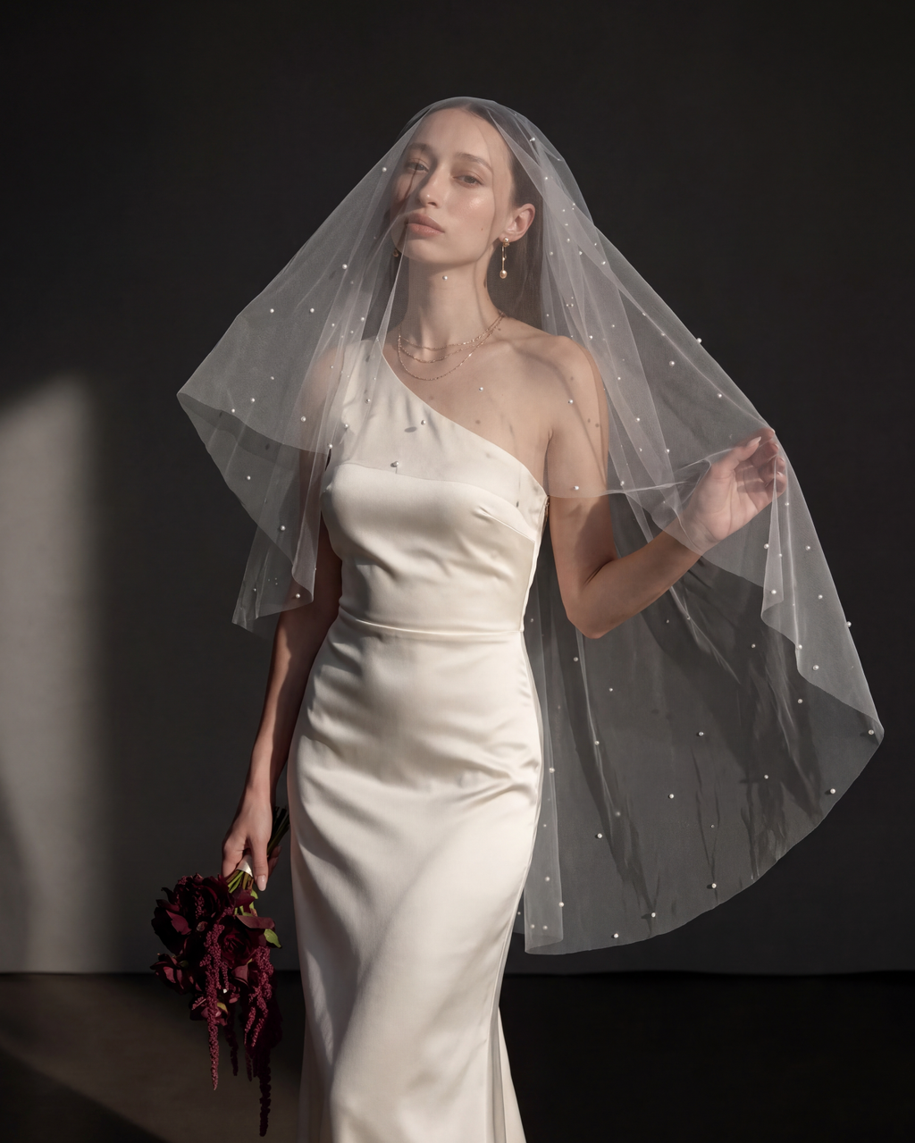 The Celeste veil — worn over the face as a blusher, front view