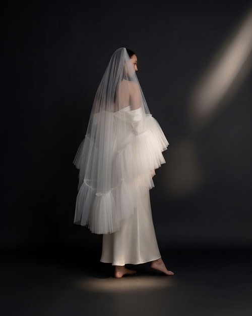 The Aria veil — side view with a satin dress