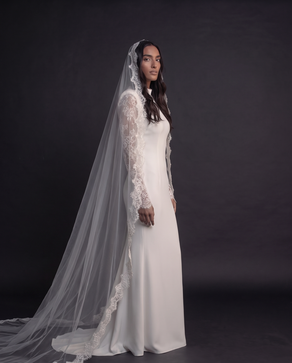 The Camila veil — three-quarter view of the long lace-edged veil