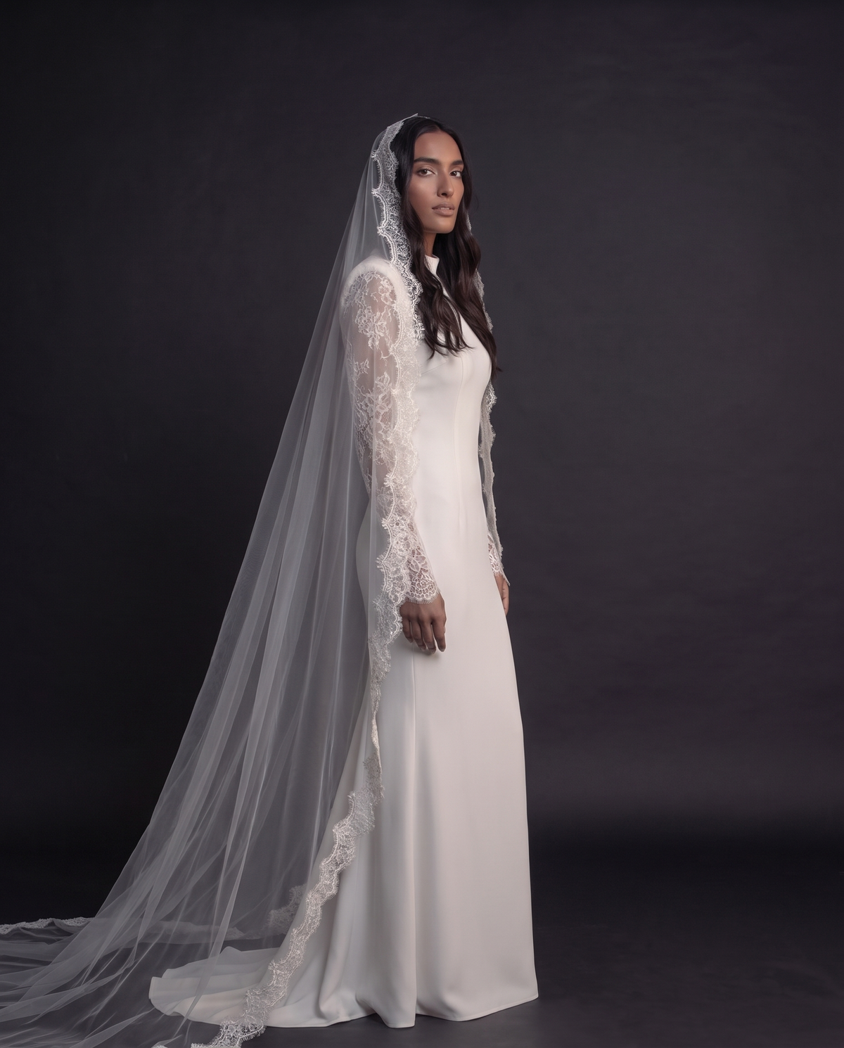 The Camila veil — three-quarter view of the long lace-edged veil
