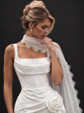 The Marisol veil — bride wearing the lace-edged tulle neck scarf