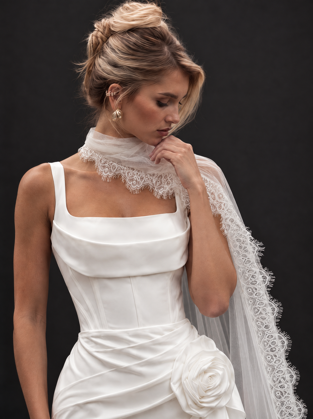 The Marisol veil — bride wearing the lace-edged tulle neck scarf