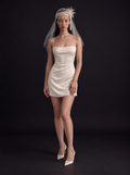 The Isolde veil — full-length front view with a short satin dress