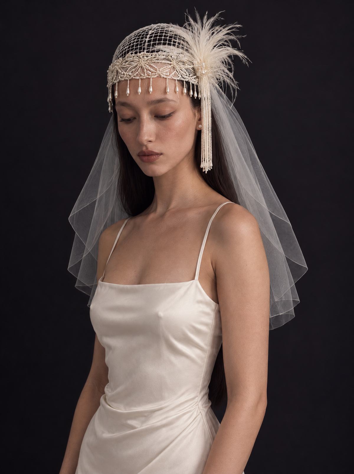The Isolde veil — beaded lace cap with feather plume and shoulder length tulle